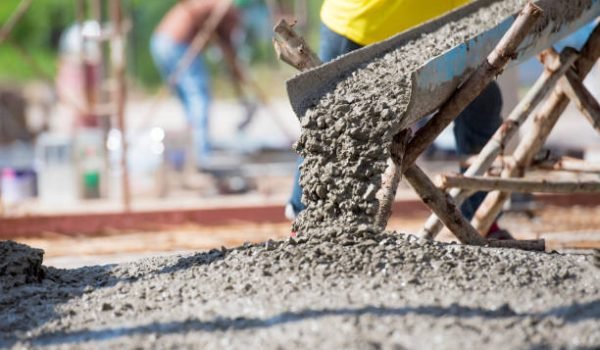 Concrete pouring during commercial concreting floors of building